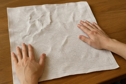 How to flatten a crumpled paint-by-numbers canvas?